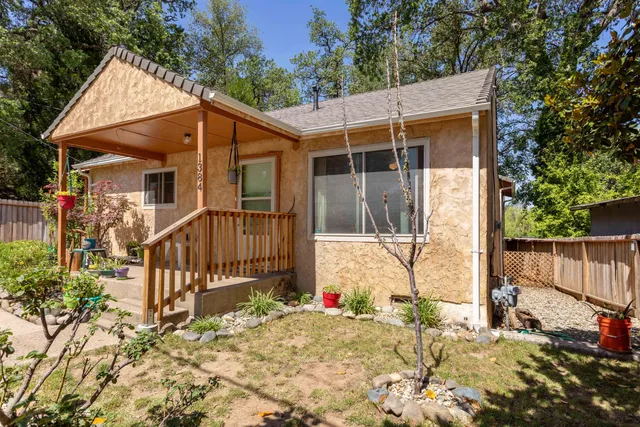 a view of a house with wooden fence