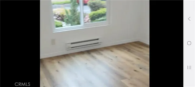 a view of backyard with plants and outdoor seating