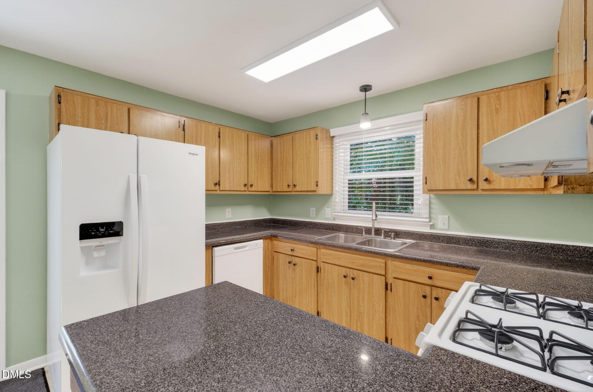 1224 Pineview Drive Raleigh, NC 27606 - Photo 14 of 45 a kitchen with stainless steel appliances granite countertop a refrigerator sink and stove