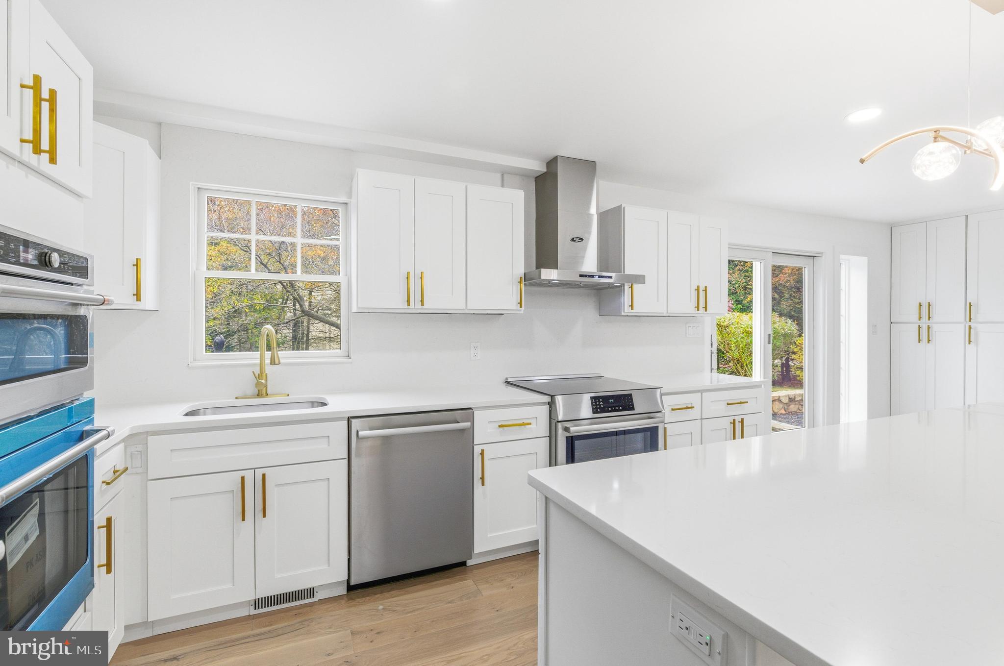 201 Church Road Devon, PA 19333 - Photo 11 of 21 a kitchen with a sink stove and cabinets