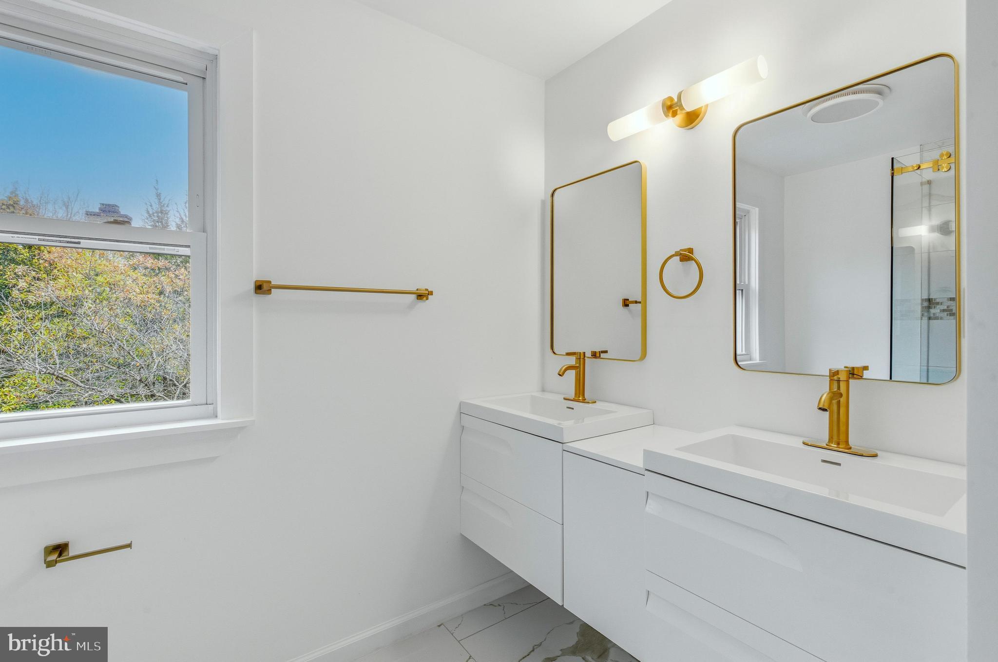 201 Church Road Devon, PA 19333 - Photo 15 of 21 a bathroom with a sink and a mirror
