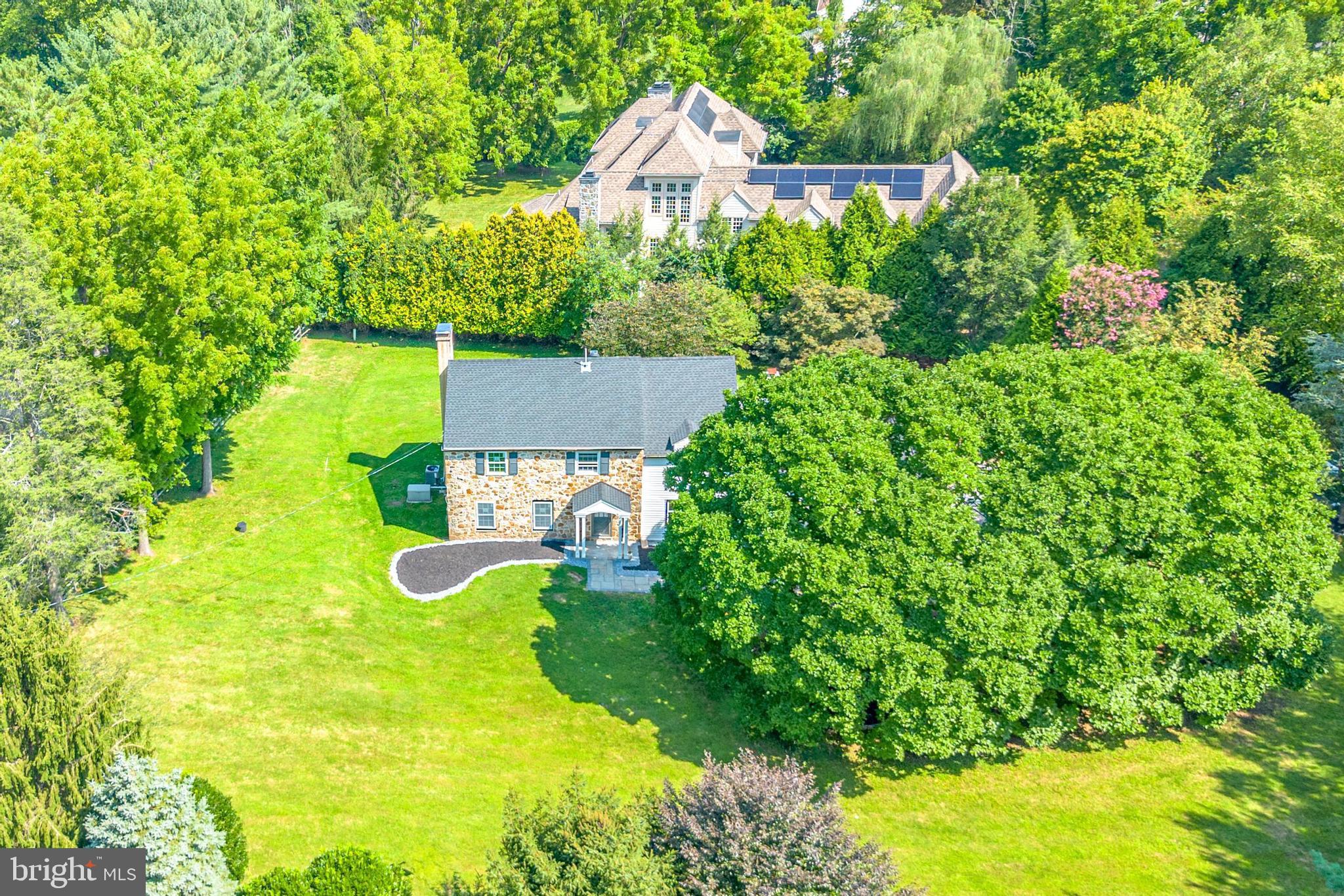 201 Church Road Devon, PA 19333 - Photo 2 of 21 an aerial view of a house with swimming pool and garden