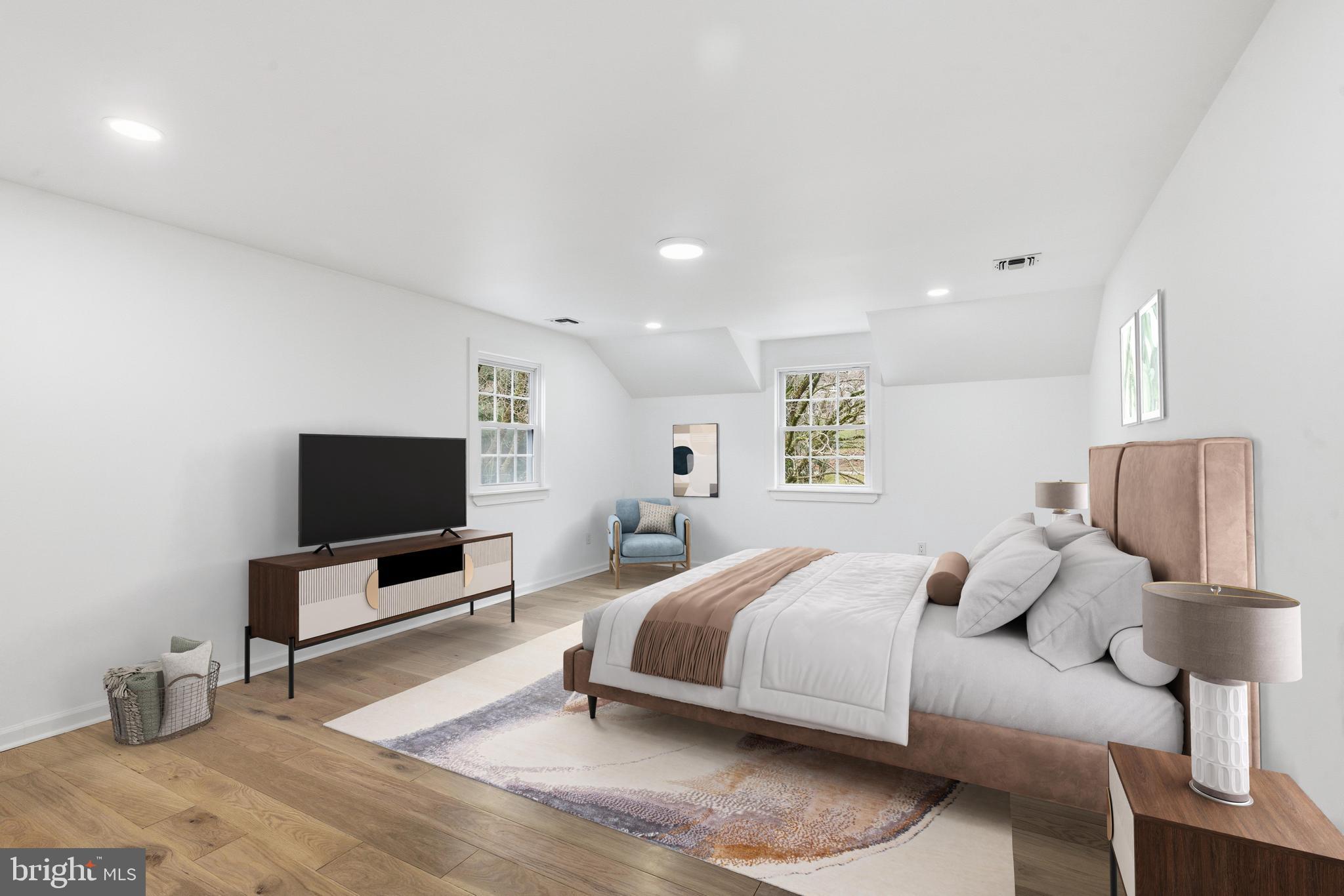 201 Church Road Devon, PA 19333 - Photo 4 of 21 a bedroom with a bed and a flat screen tv