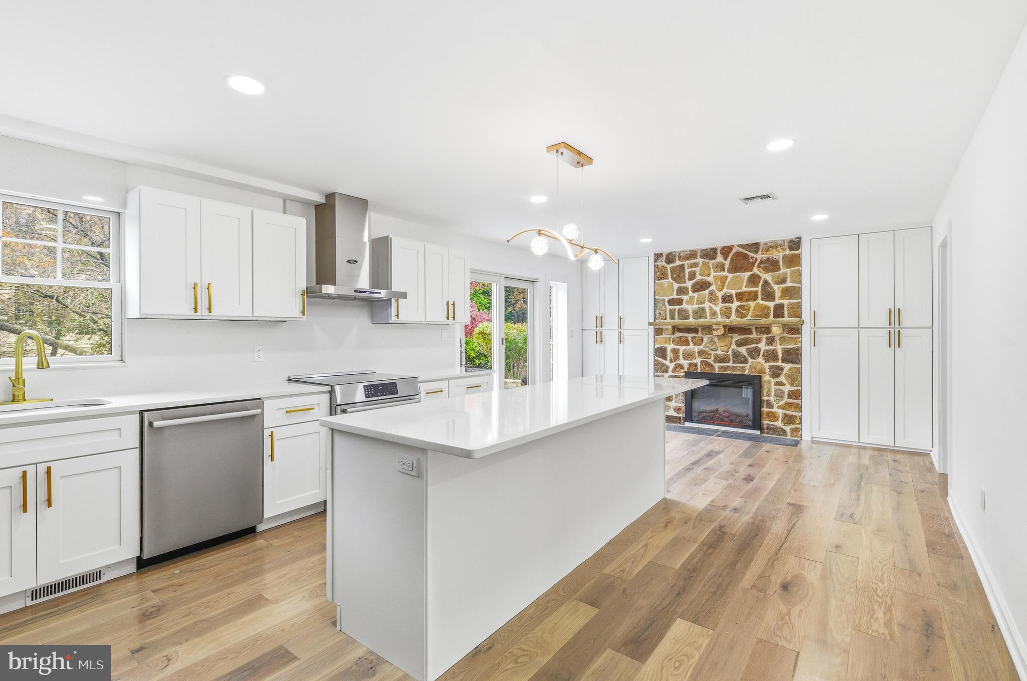 201 Church Road Devon, PA 19333 - Photo 5 of 21 a kitchen with stainless steel appliances a sink stove and cabinets