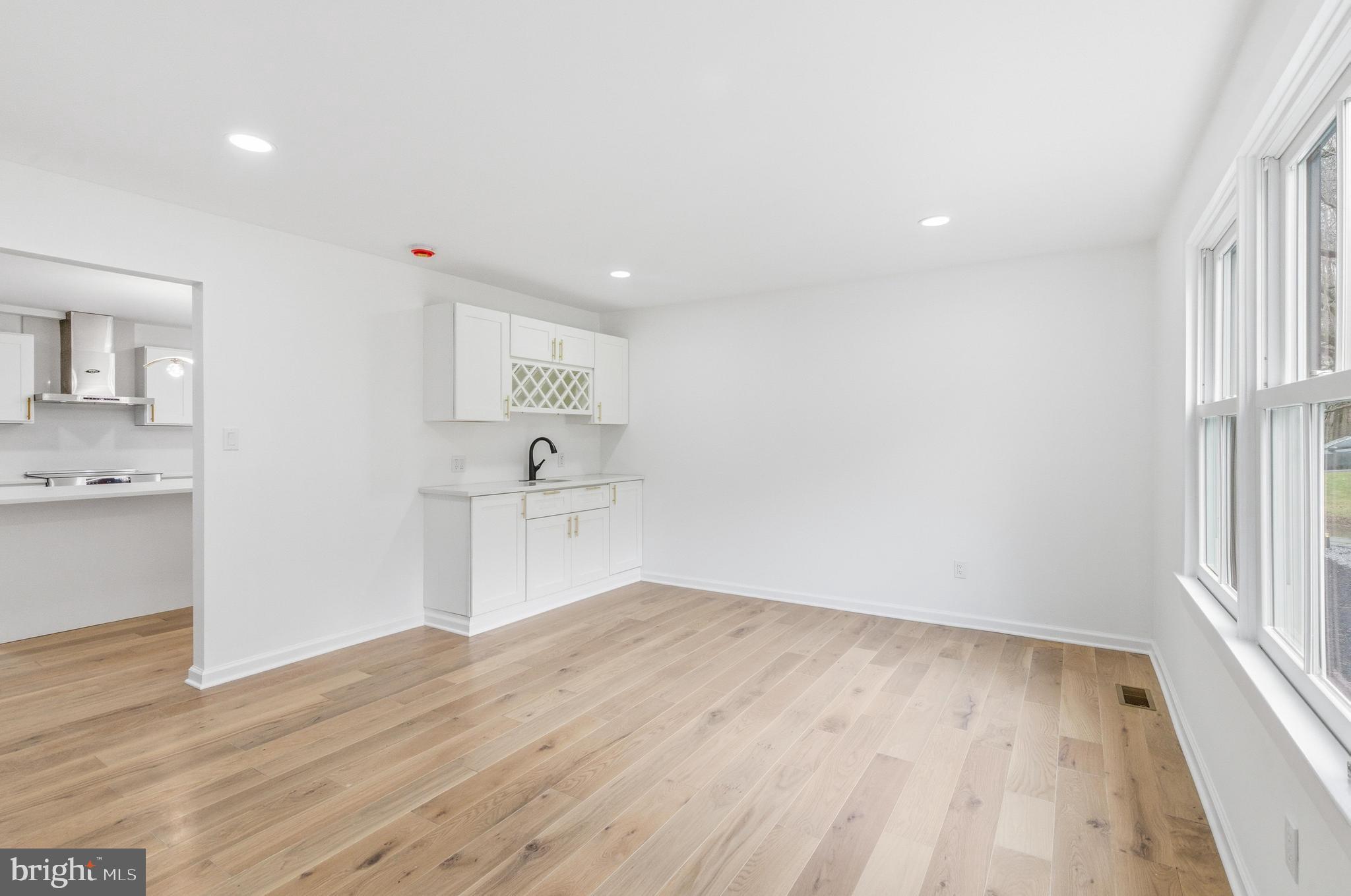 201 Church Road Devon, PA 19333 - Photo 9 of 21 a view of a kitchen with wooden floor and a sink