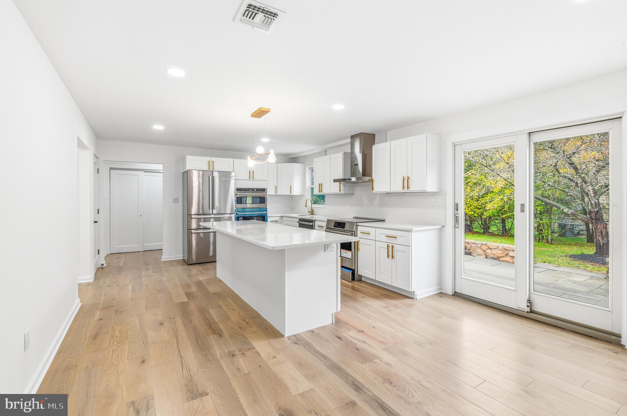 201 Church Road Devon, PA 19333 - Photo 10 of 21 a large white kitchen with a large window