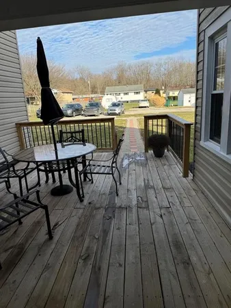 a view of roof deck with patio