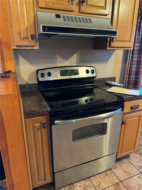 30 Summit Street Clarksville, PA 15322 - Photo 8 of 20 a stove top oven sitting inside of a kitchen