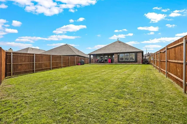 a view of a garden with a small pool