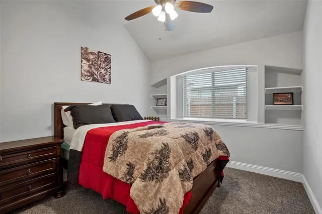 a bedroom with bed and window