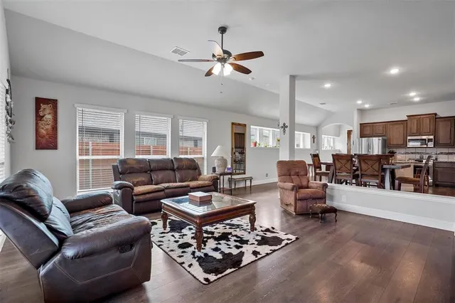 a living room with furniture and a large window