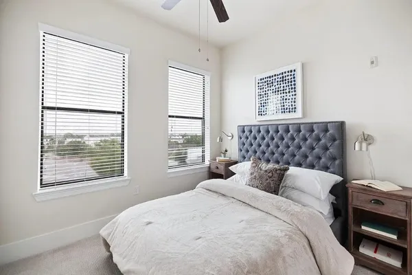 a bathroom with a granite countertop sink a toilet and a bathtub