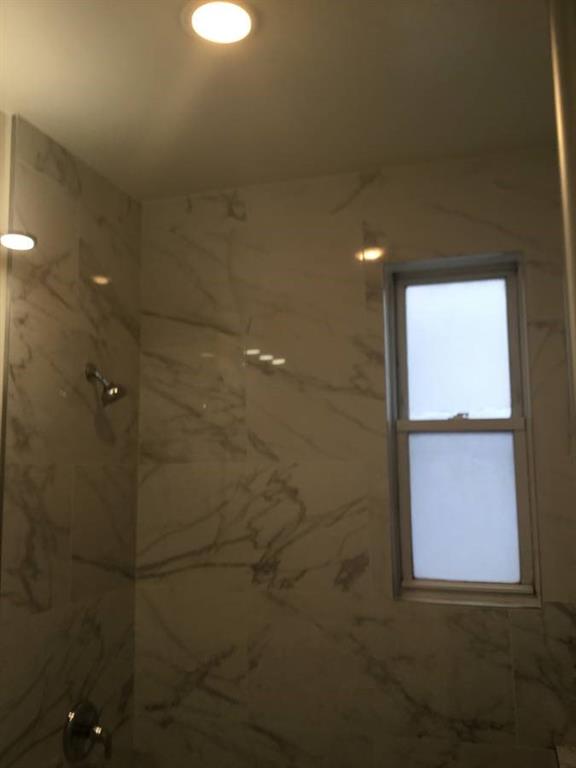 9307 3rd Avenue Brooklyn, NY 11209 - Photo 12 of 23 a bathroom with a shower
