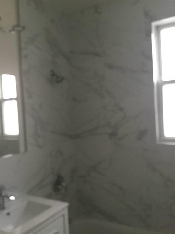 9307 3rd Avenue Brooklyn, NY 11209 - Photo 14 of 23 a bathroom with a shower