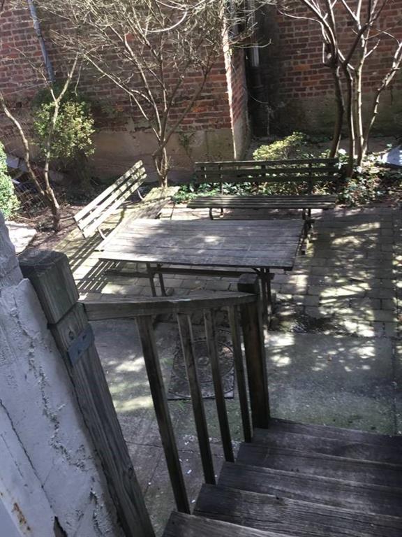 9307 3rd Avenue Brooklyn, NY 11209 - Photo 15 of 23 a view of a house with a tree