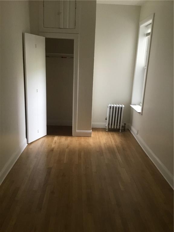 9307 3rd Avenue Brooklyn, NY 11209 - Photo 17 of 23 an empty room with windows and closet