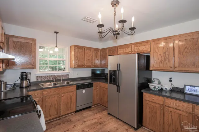 a kitchen with a stove and a microwave