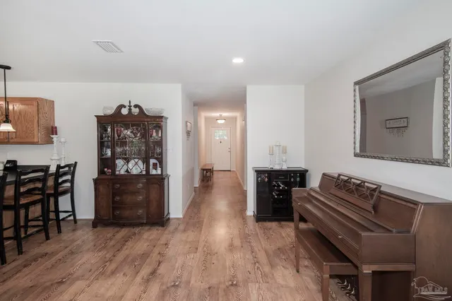 a bedroom with a bed and a view of closet