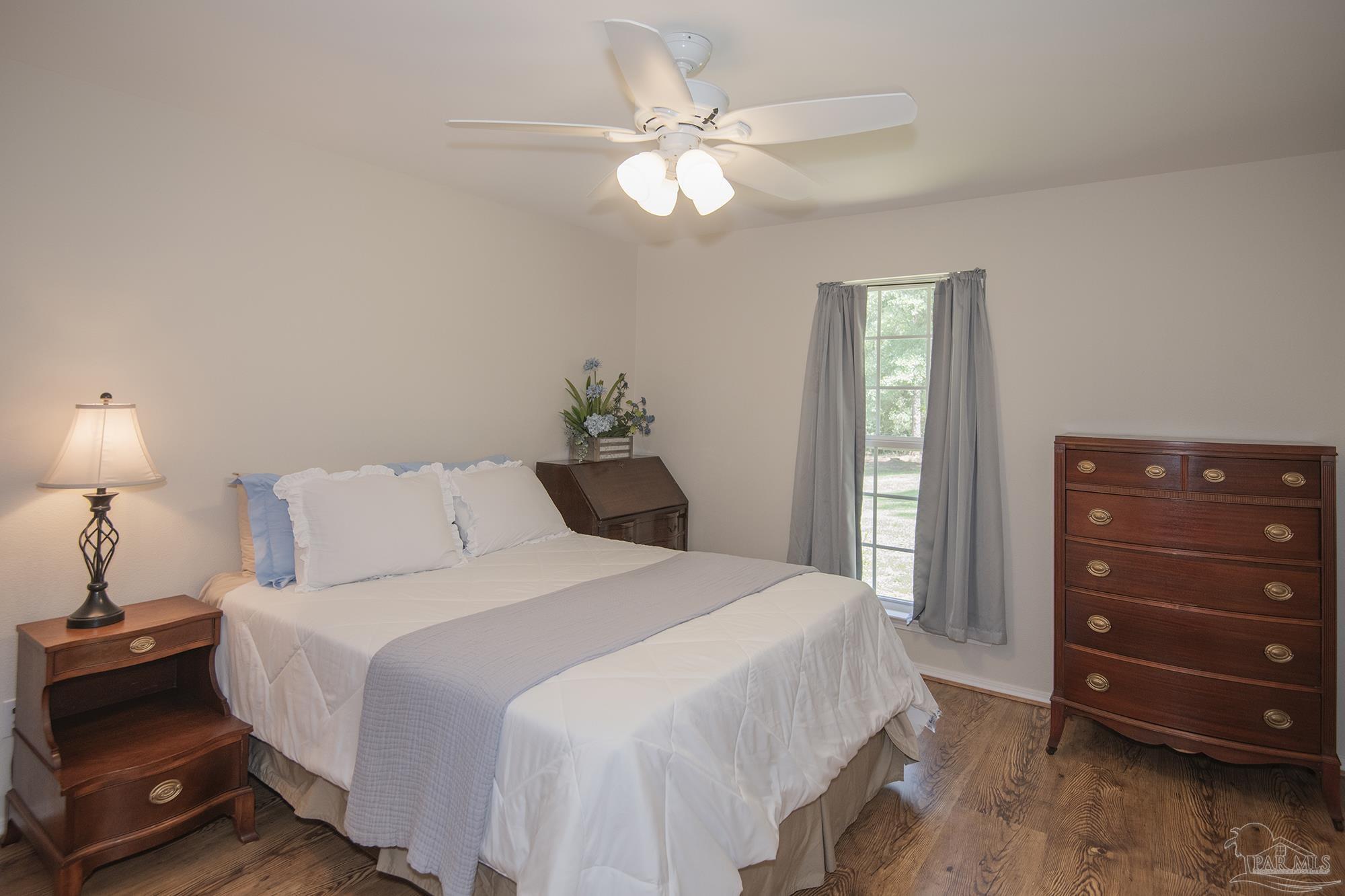 8501 Highway 97 Walnut Hill, FL 32568 - Photo 23 of 55 a bedroom with a bed and a closet