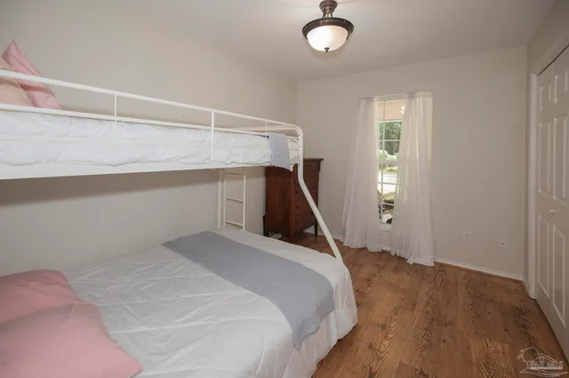 a bed room with a bed and a window