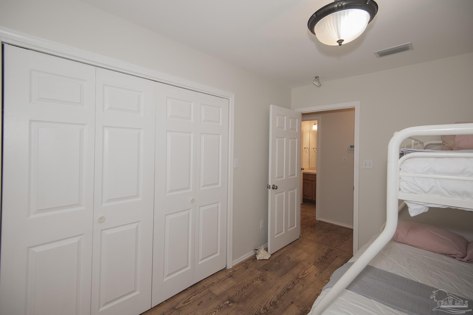 8501 Highway 97 Walnut Hill, FL 32568 - Photo 27 of 55 a view of a livingroom with wooden floor cabinet and a bathroom