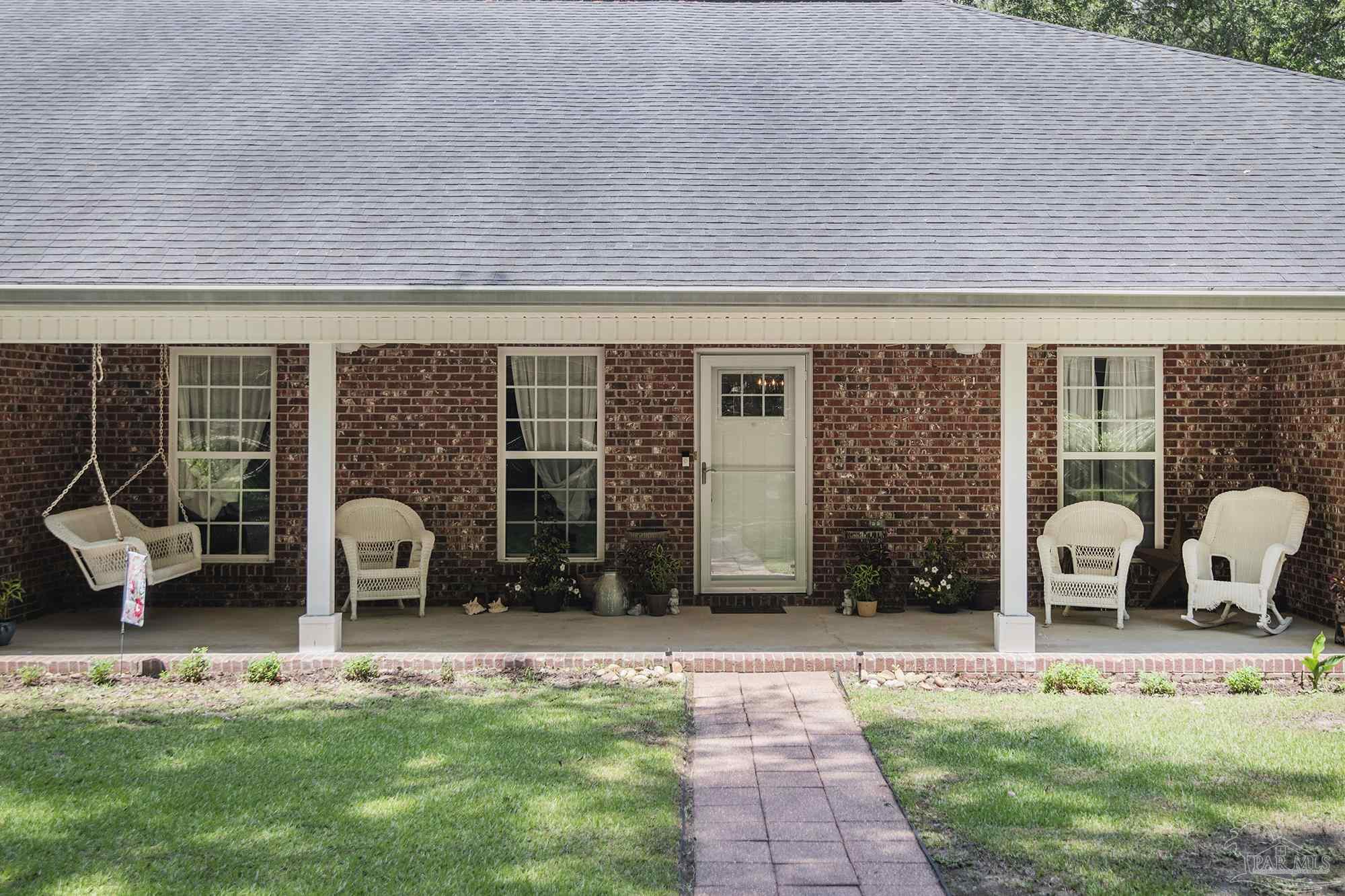 8501 Highway 97 Walnut Hill, FL 32568 - Photo 3 of 55 a view of outdoor space yard deck patio and swimming pool