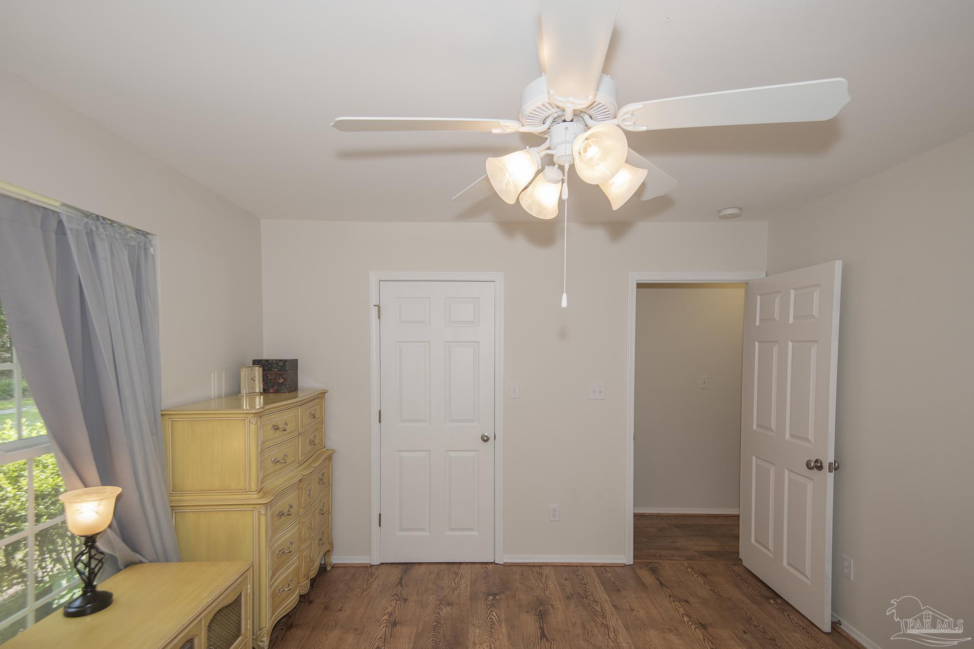 8501 Highway 97 Walnut Hill, FL 32568 - Photo 31 of 55 wooden floor in an empty room