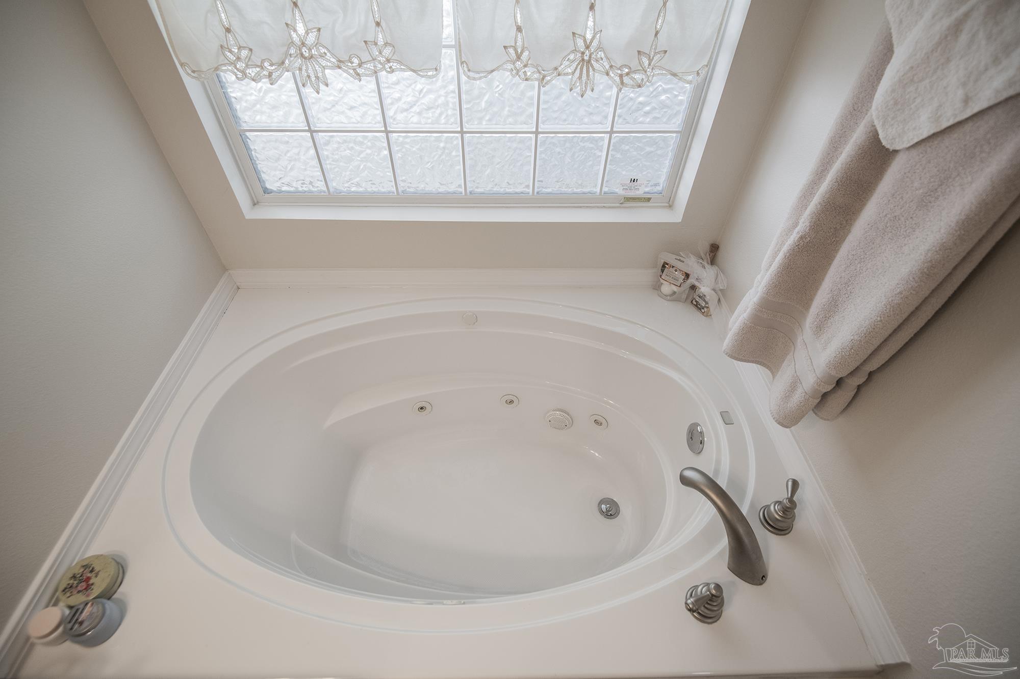 8501 Highway 97 Walnut Hill, FL 32568 - Photo 32 of 55 a bathroom with a bathtub