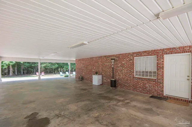a view of a house with a yard and sitting area