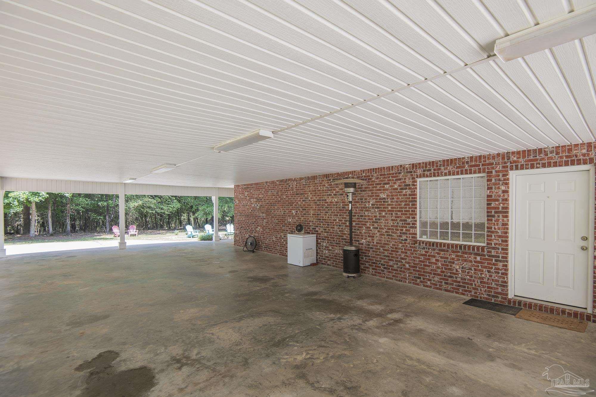 8501 Highway 97 Walnut Hill, FL 32568 - Photo 44 of 55 a view of an empty room with windows