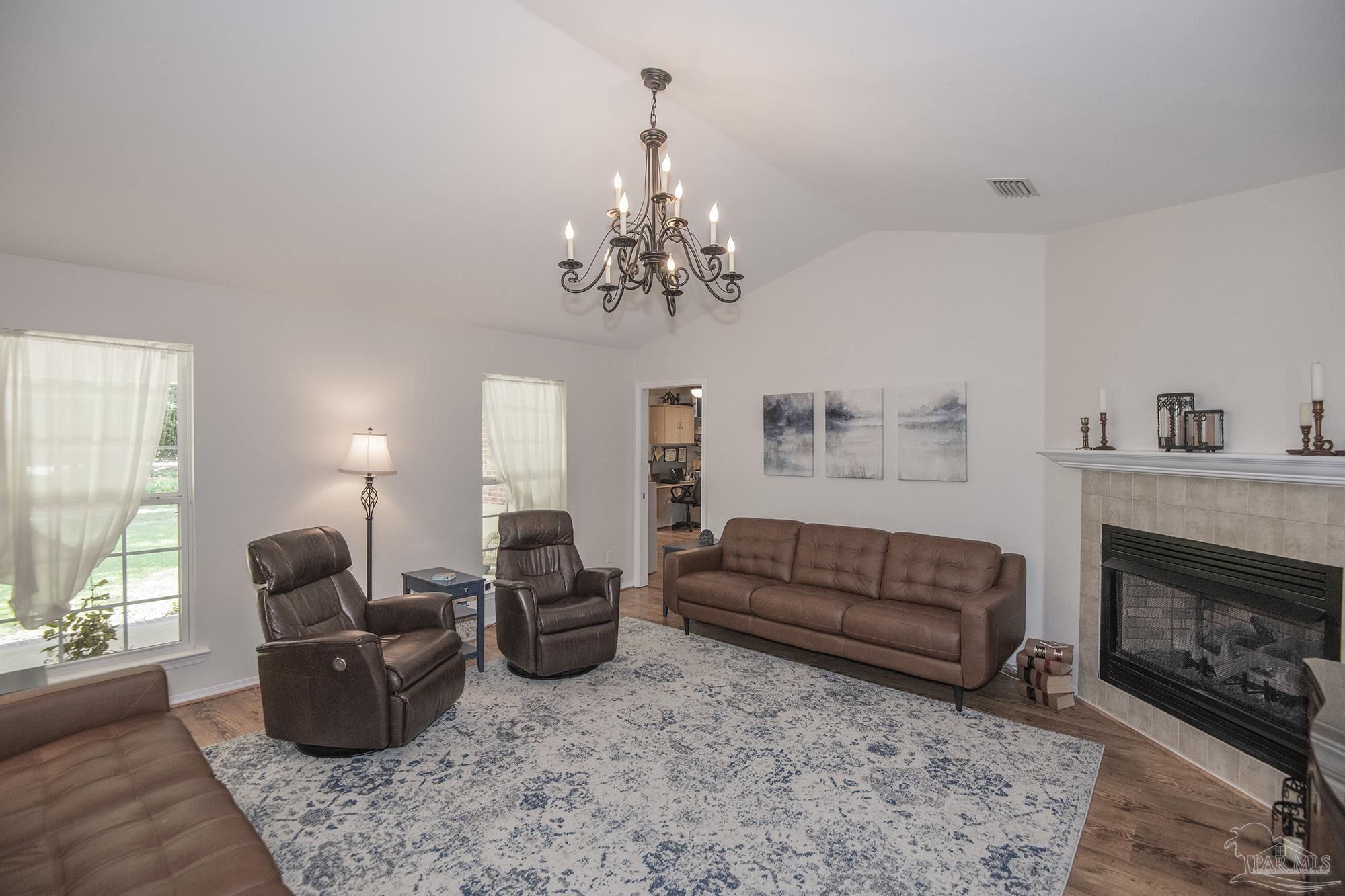 8501 Highway 97 Walnut Hill, FL 32568 - Photo 6 of 55 a living room with furniture and a fireplace