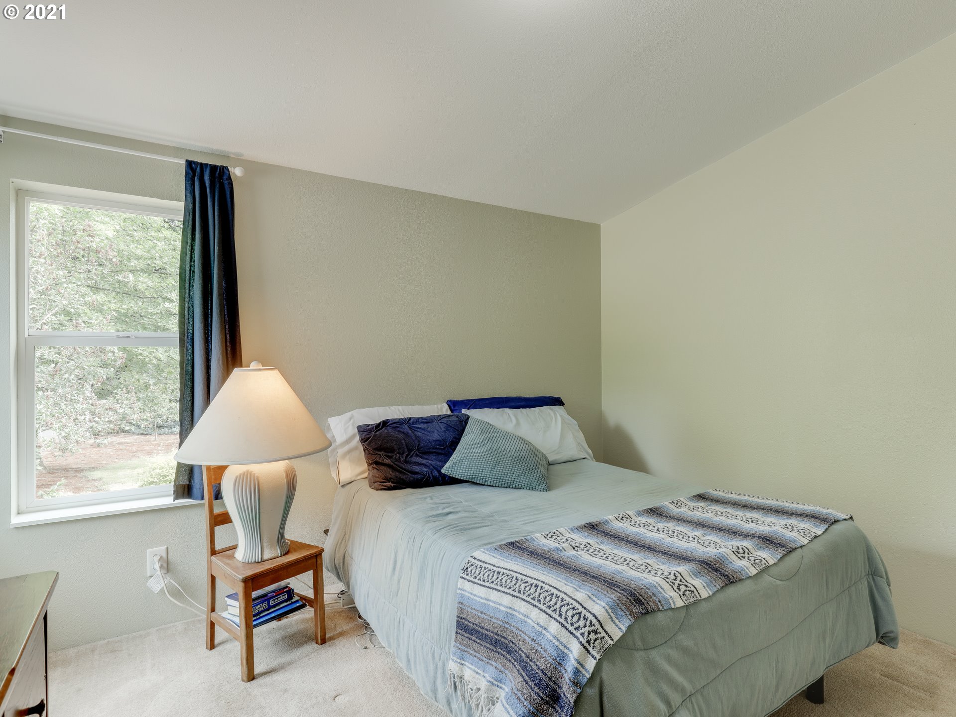 44644 Southeast Coalman Road Sandy, OR 97055 - Photo 18 of 31 a bedroom with a bed and a window