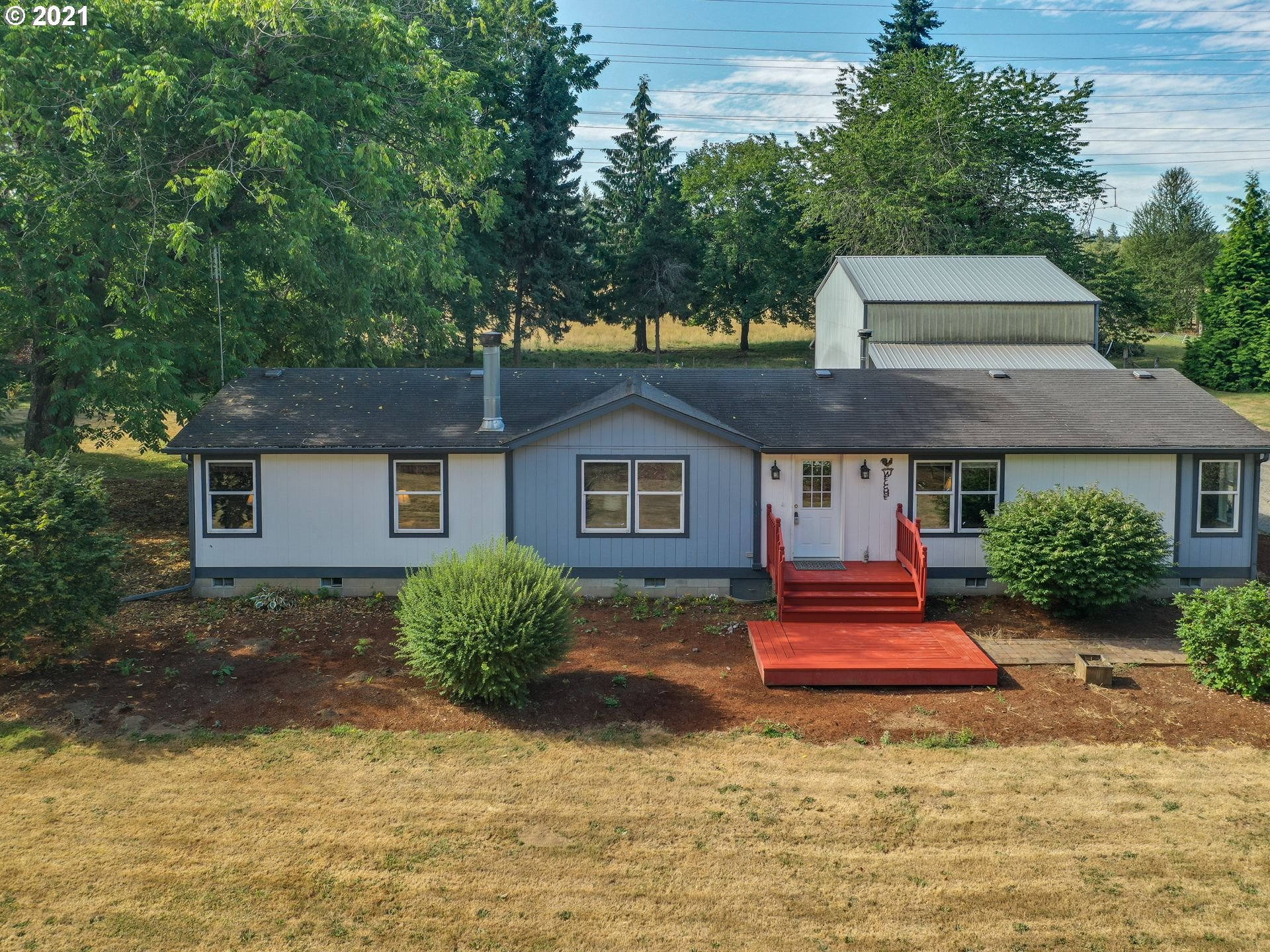 44644 Southeast Coalman Road Sandy, OR 97055 - Photo 2 of 31 a front view of a house with a yard
