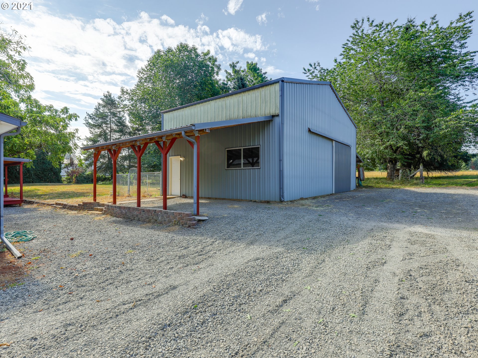 44644 Southeast Coalman Road Sandy, OR 97055 - Photo 22 of 31 a view of a house with backyard and trees