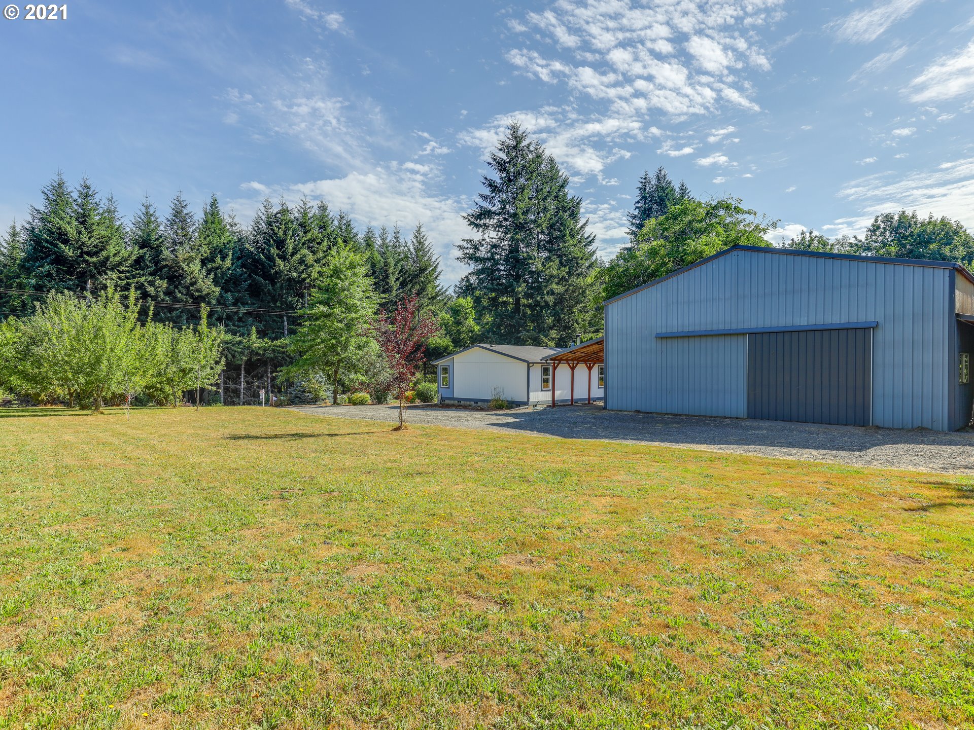 44644 Southeast Coalman Road Sandy, OR 97055 - Photo 27 of 31 a view of a house with a yard and garage