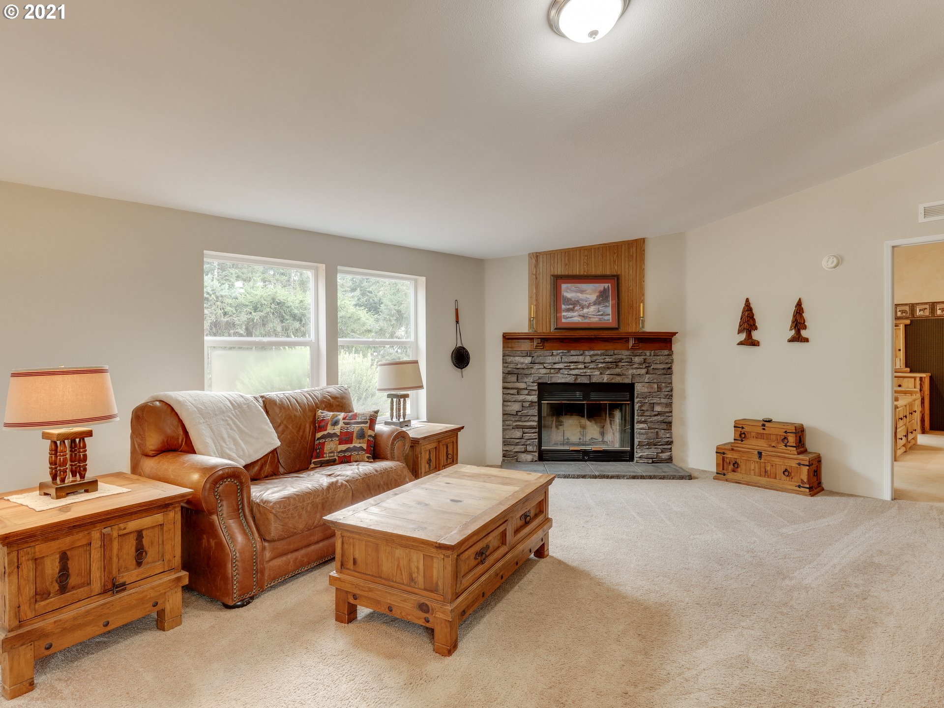 44644 Southeast Coalman Road Sandy, OR 97055 - Photo 5 of 31 a living room with furniture and a fireplace