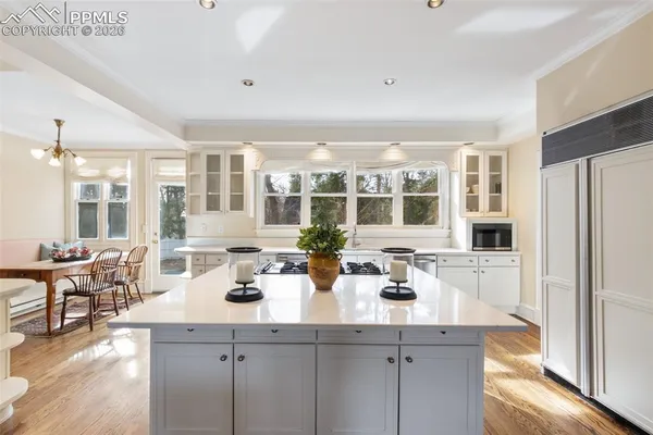 a kitchen with lots of counter top space and living room
