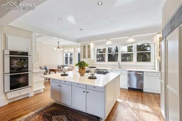 a kitchen with a sink stove and microwave