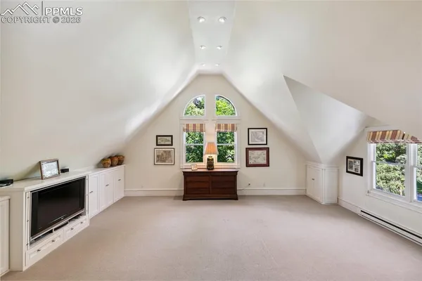 a view of a livingroom with furniture and staircase