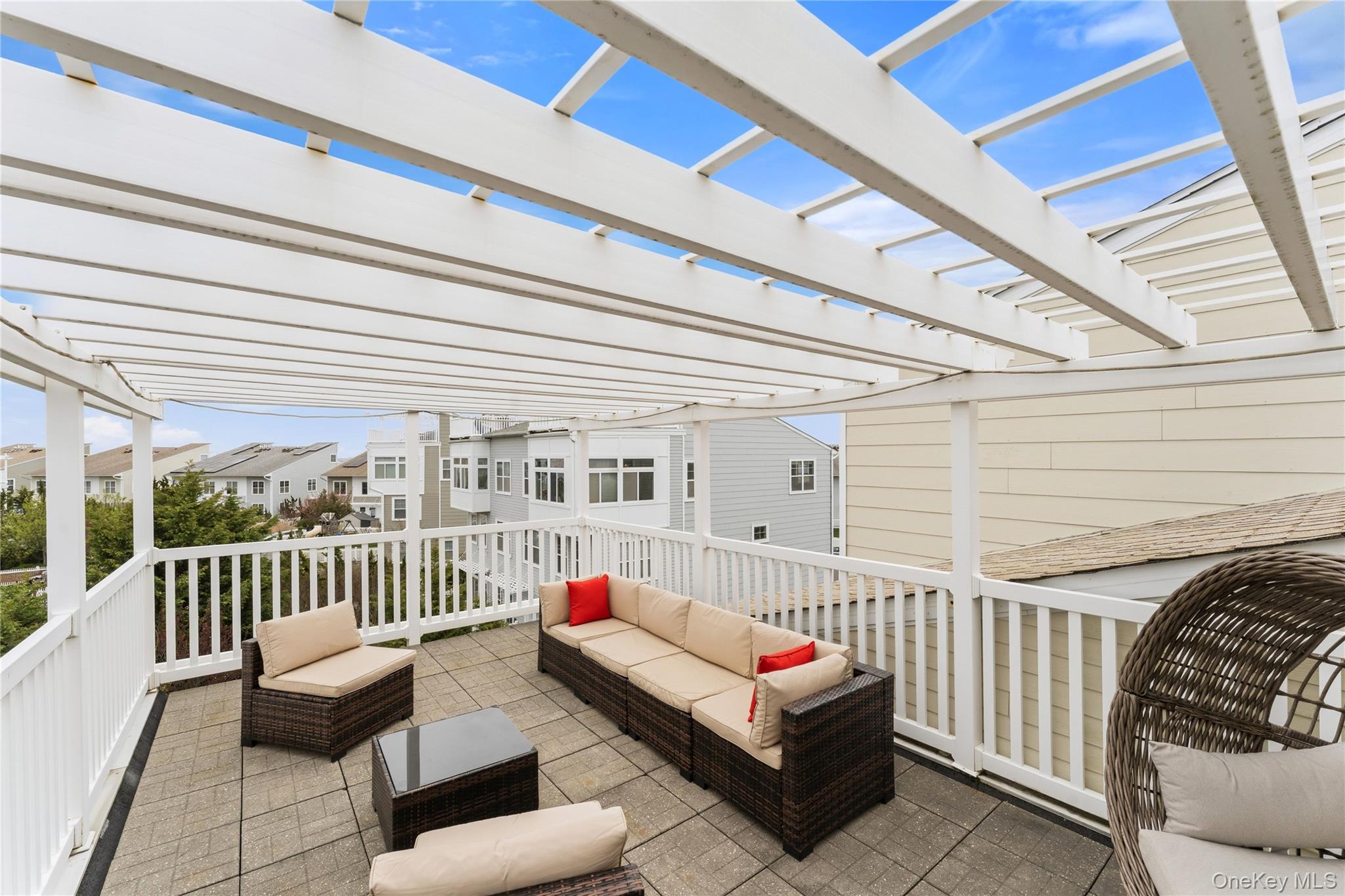 136 Meridian Boulevard Queens, NY 11692 - Photo 2 of 29 a balcony with furniture and white walls