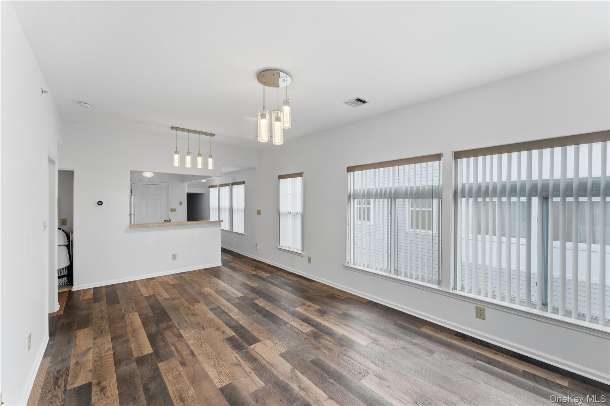 136 Meridian Boulevard Queens, NY 11692 - Photo 23 of 29 a view of empty room with wooden floor