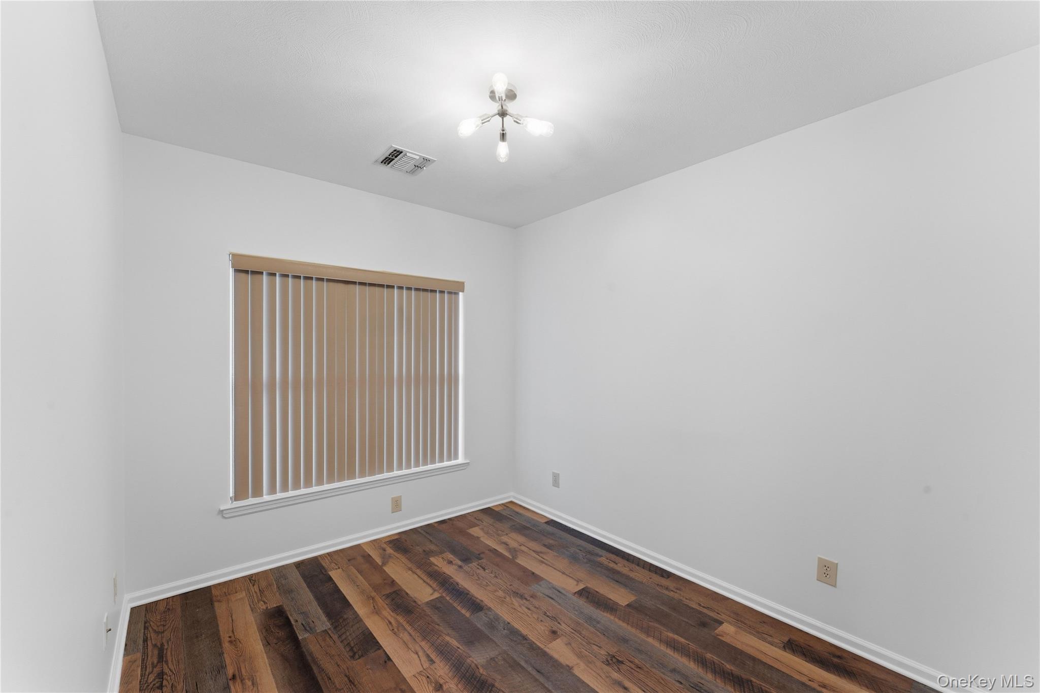 136 Meridian Boulevard Queens, NY 11692 - Photo 24 of 29 an empty room with a window