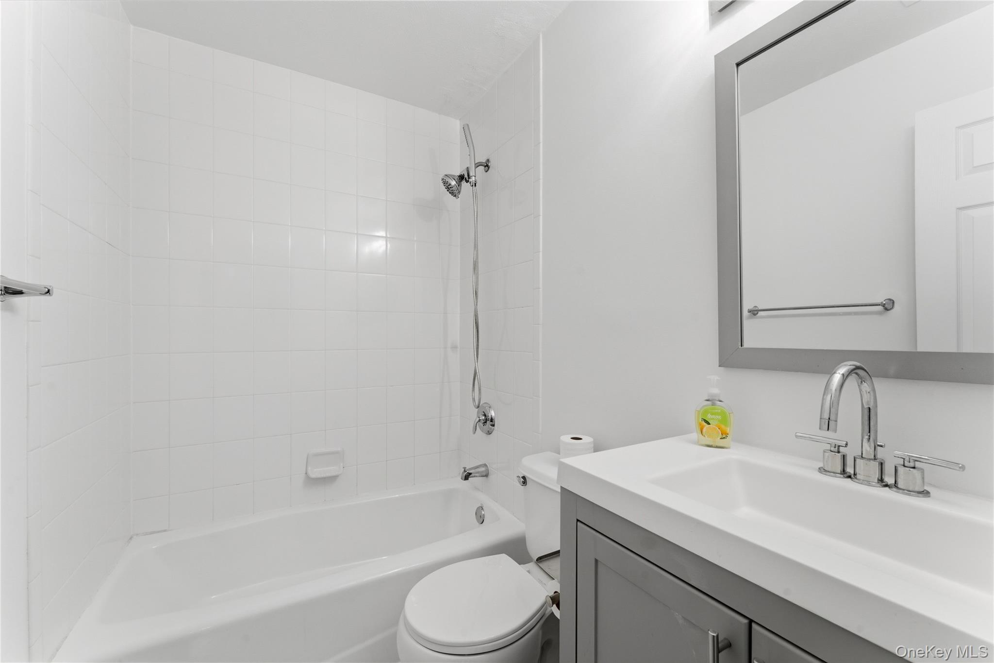 136 Meridian Boulevard Queens, NY 11692 - Photo 26 of 29 a bathroom with a sink toilet and shower