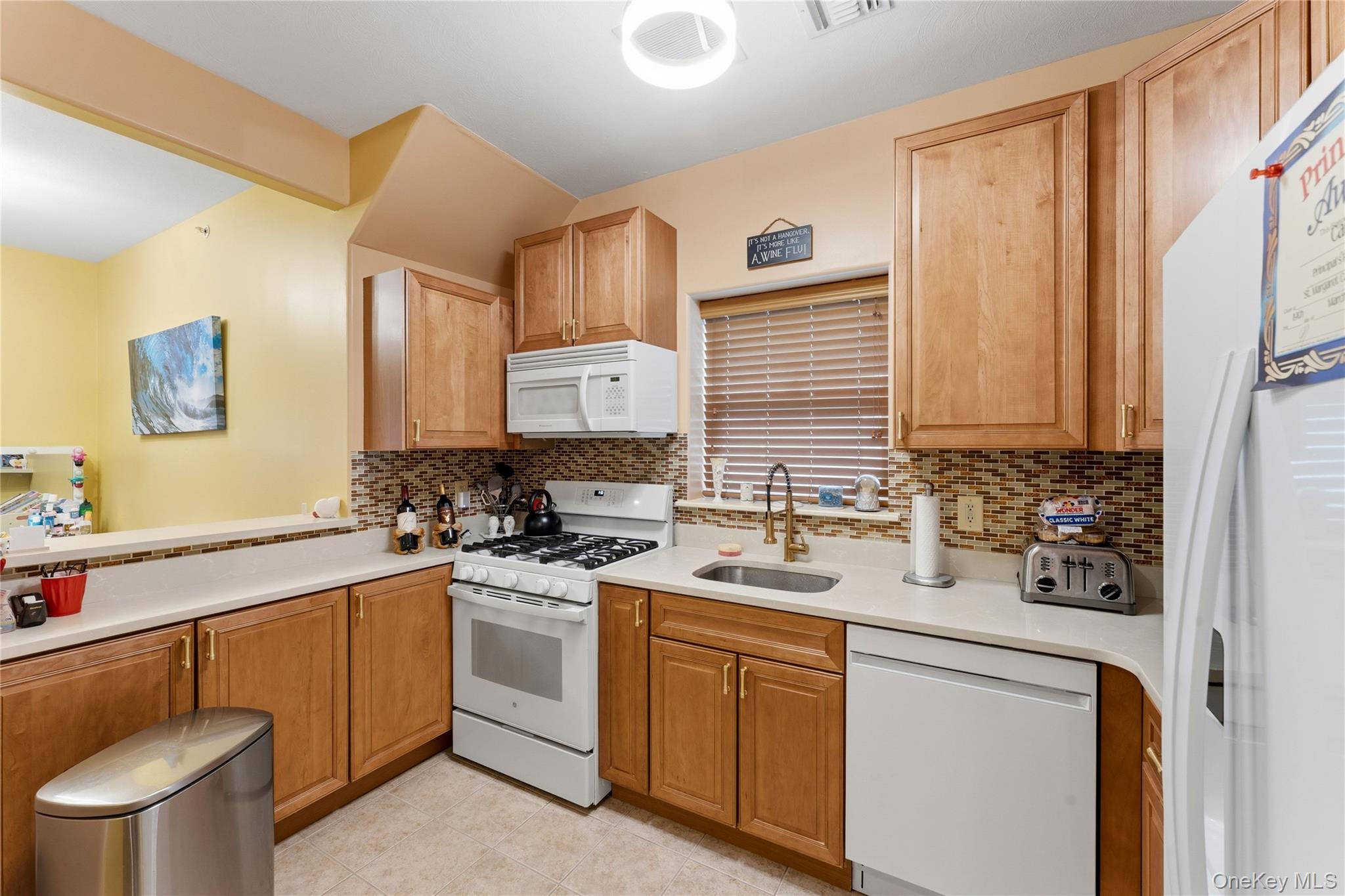 136 Meridian Boulevard Queens, NY 11692 - Photo 7 of 29 a kitchen with a sink stove and cabinets
