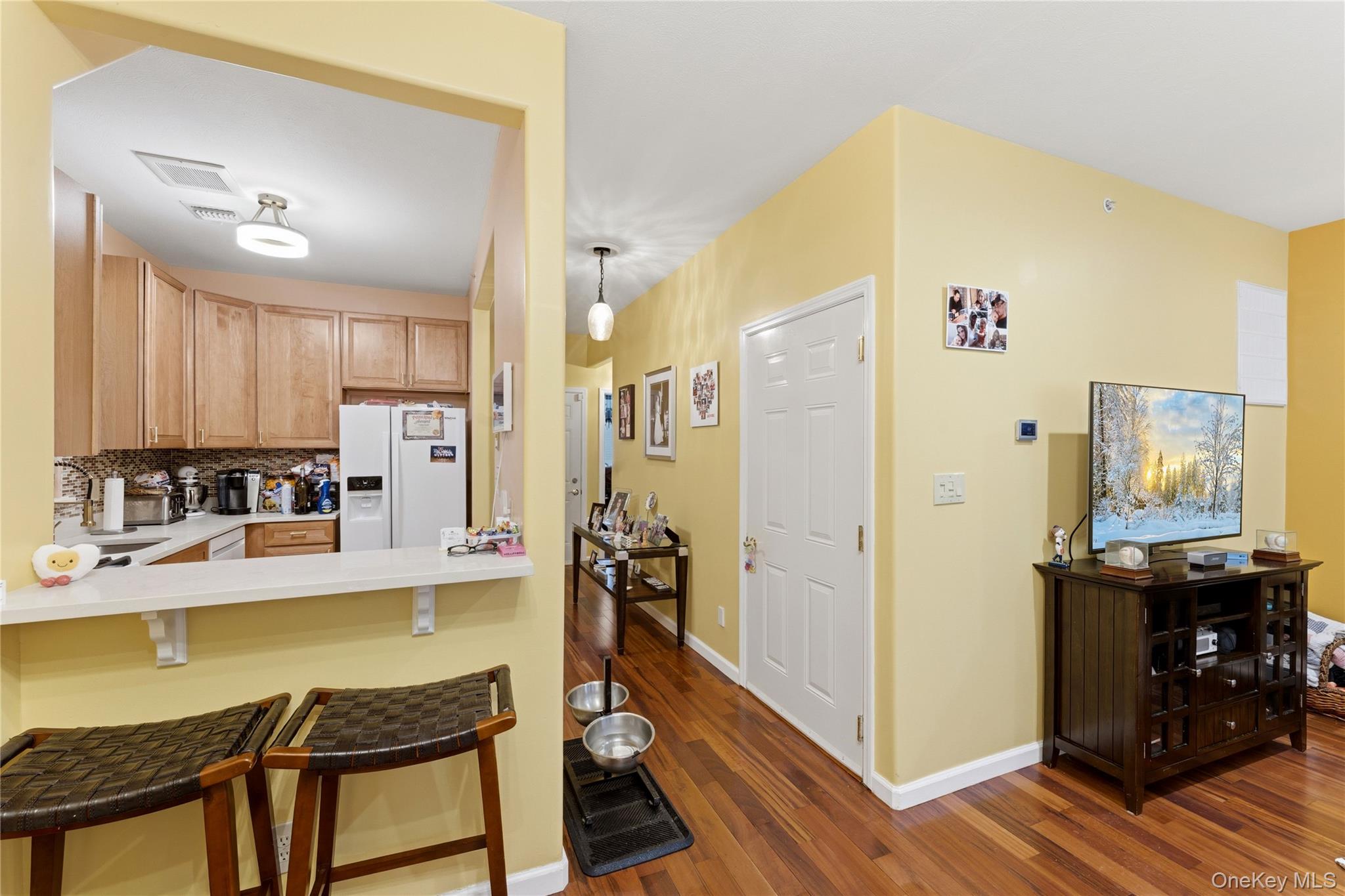 136 Meridian Boulevard Queens, NY 11692 - Photo 8 of 29 a dining room with stainless steel appliances kitchen island granite countertop furniture and a refrigerator