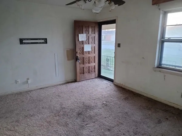 a view of empty room with windows