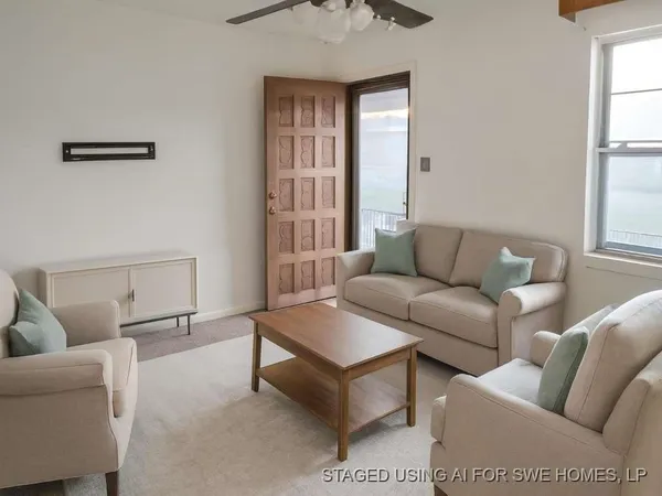 a living room with furniture and a window