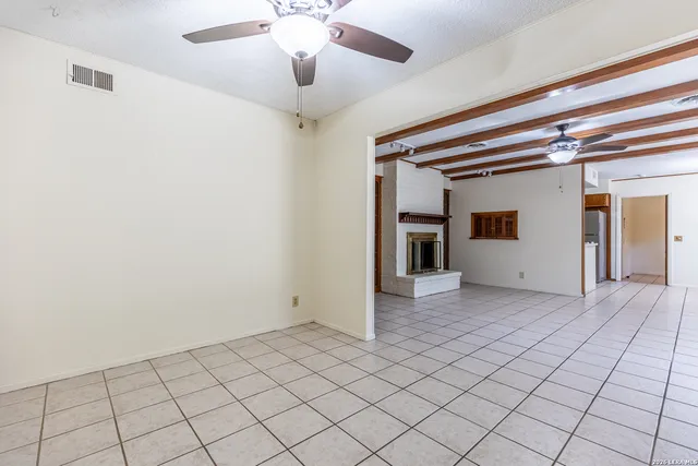 a kitchen with stainless steel appliances a refrigerator and microwave