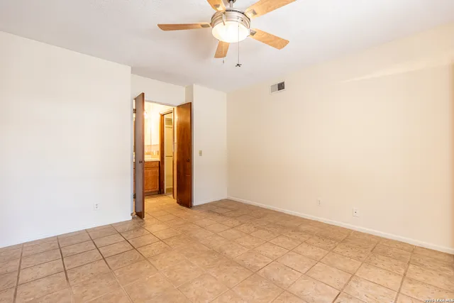 a white bath tub sitting next to a white toilet
