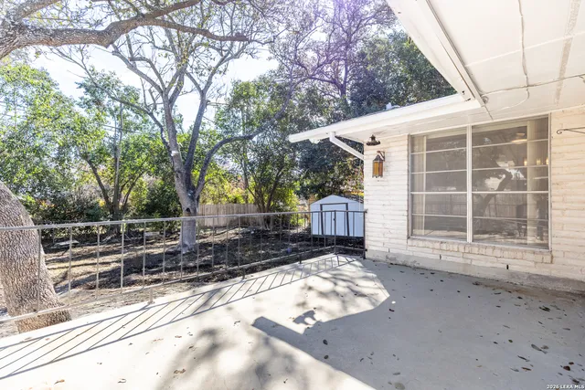 a view of yard covered with snow in front of house